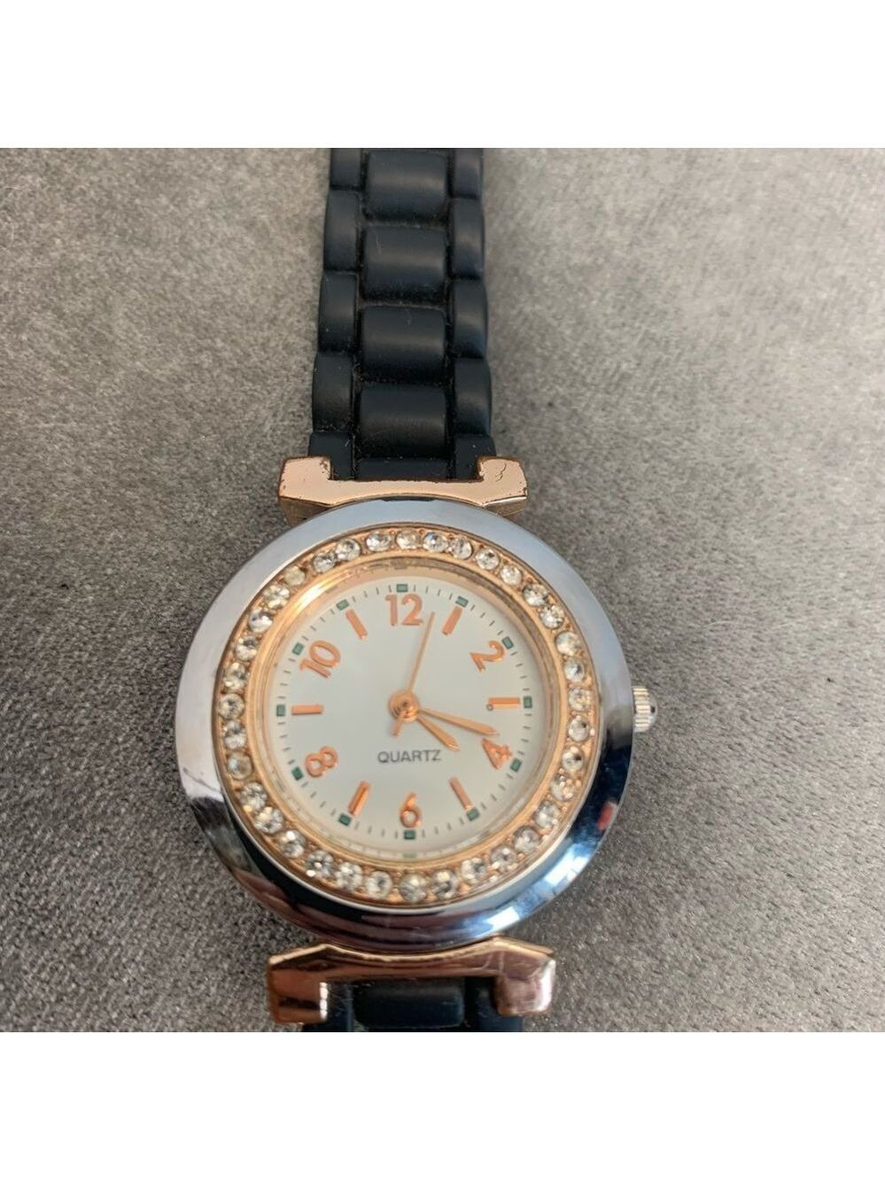 QUARTZ black rubber band round face rhinestone watch